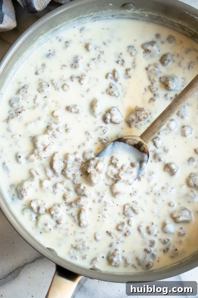 Large skillet full of creamy homemade sausage gravy.