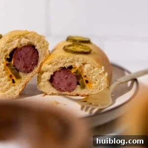 Texas Klobasnek Sausage Kolaches 11 Cut open kolache with sausage, jalapeno and cheese.