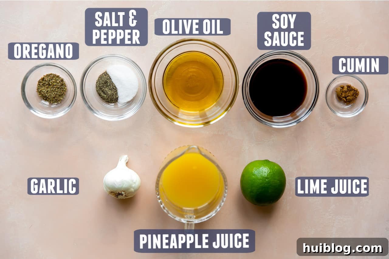 Ingredients needed for fajita marinade laid out on the counter, showcasing fresh lime, pineapple juice, and spices.