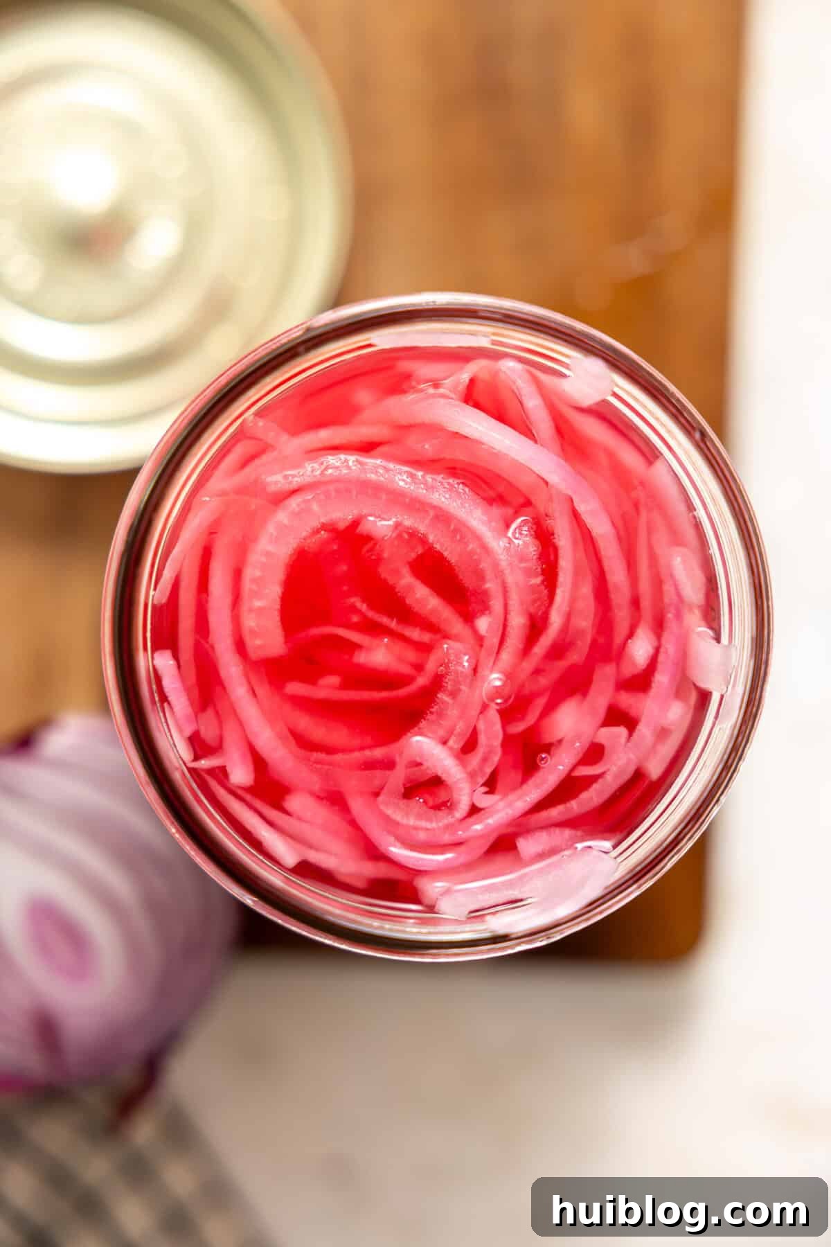 My Secret Weapon Pickled Red Onions 9 Overhead look at pickled red onions in a jar.