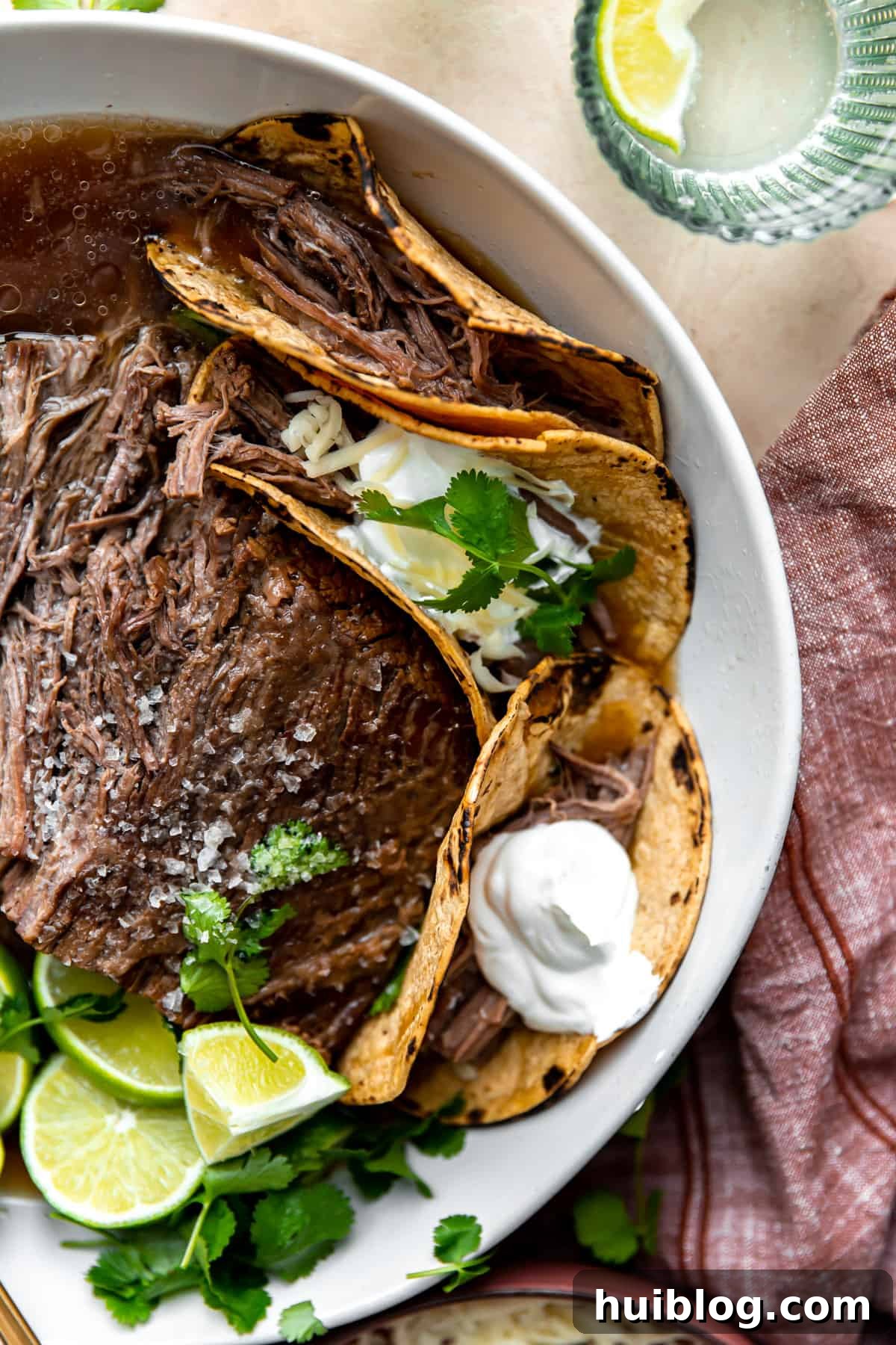 Fall-Apart Slow Cooker Brisket Tacos 6 Bowl filled with shredded brisket meat for tacos.