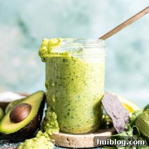 Jar of avocado salsa, ready to be served.