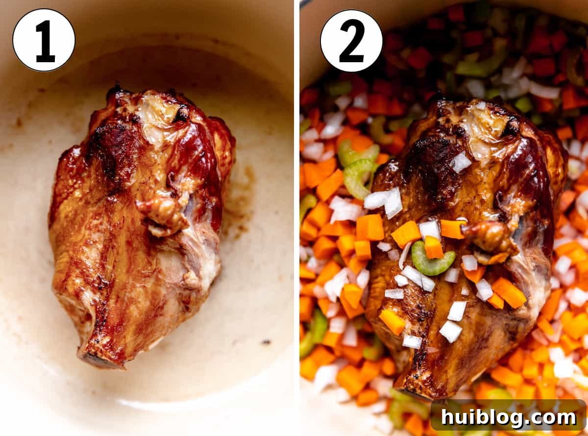 A ham bone searing in a large Dutch oven with diced carrots, celery, and onion gently sautéing, building the flavor base for the broth.