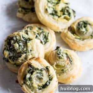 Flaky Spinach Artichoke Swirls 6 Puff Pastry Spinach and Artichoke Pinwheels, a perfect appetizer loaded with flavor.