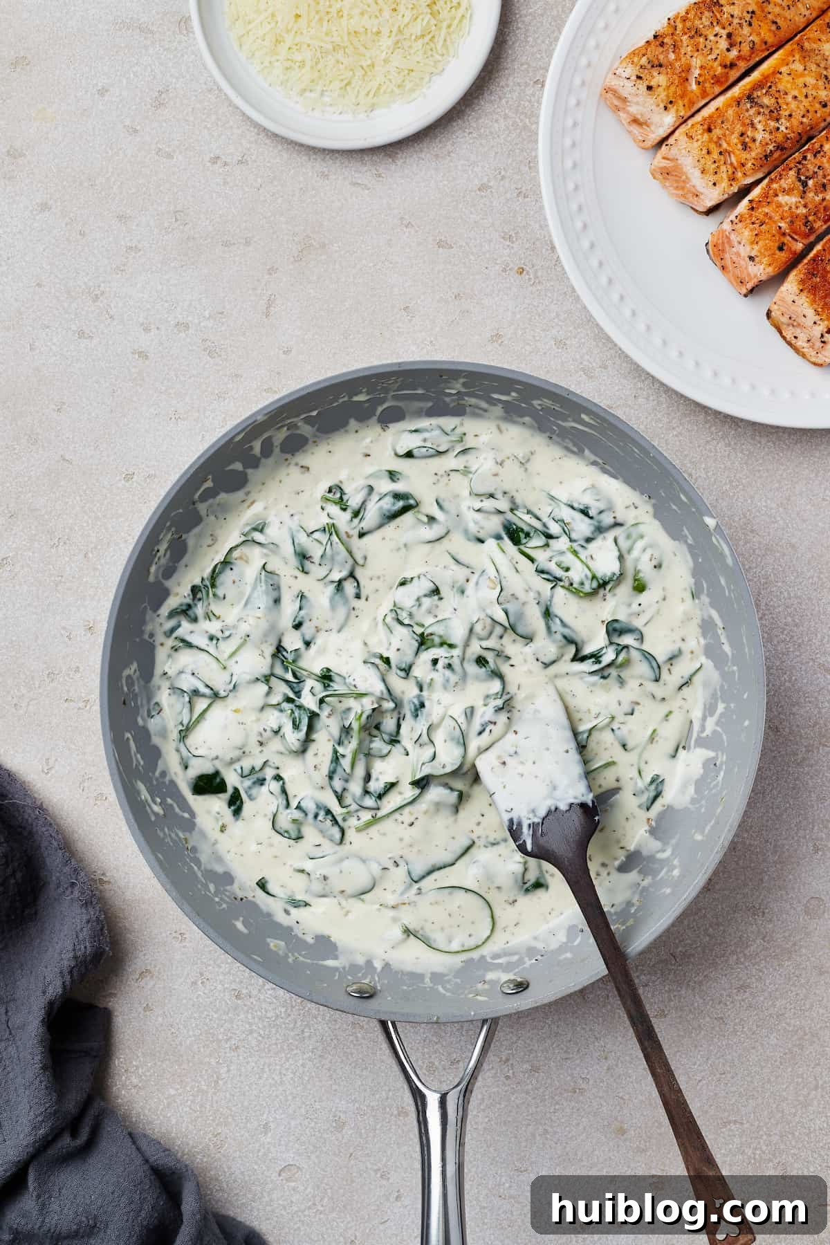A creamy spinach sauce in a nonstick skillet.