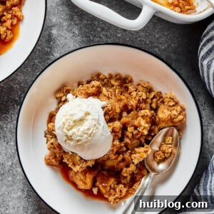 Ice-cream topped apple bake, with an oat topping.