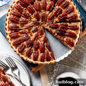 A slice of pie on a small serving dish, next to the larger pie.