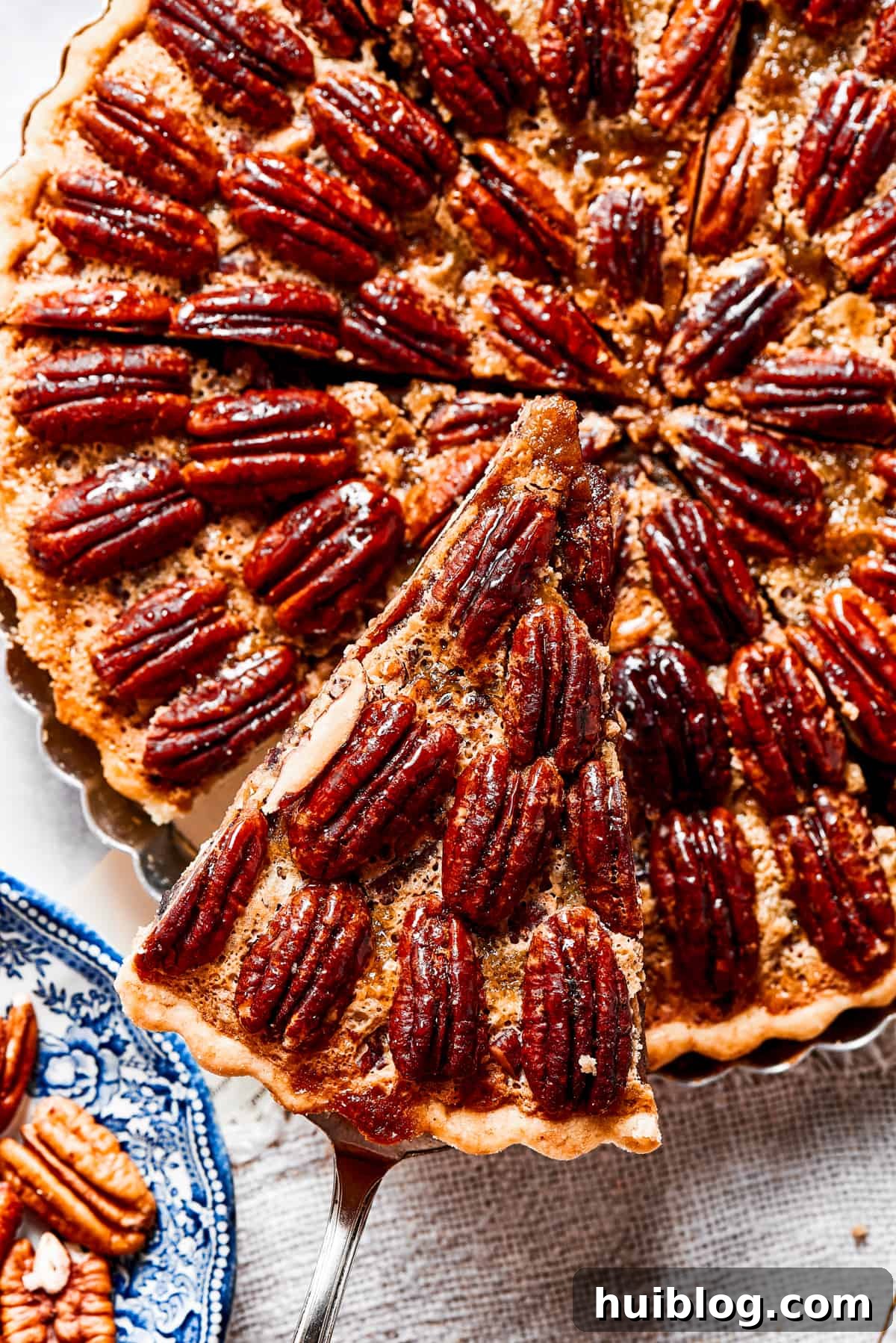 Close-up shot of a slice of pie being lifted out of the pan.