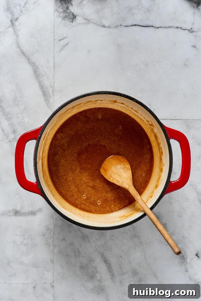 A sugar-syrup mixture in a saucepan.