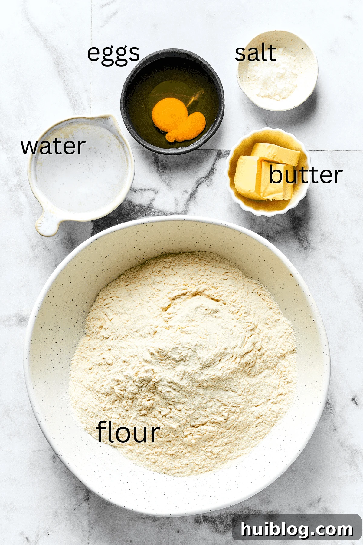 Topped with caramelized onion and crispy bacon, this easy Homemade Pierogi Recipe features a traditional cheese and potato filling. Yum! From top: Water, eggs, salt, butter, flour.