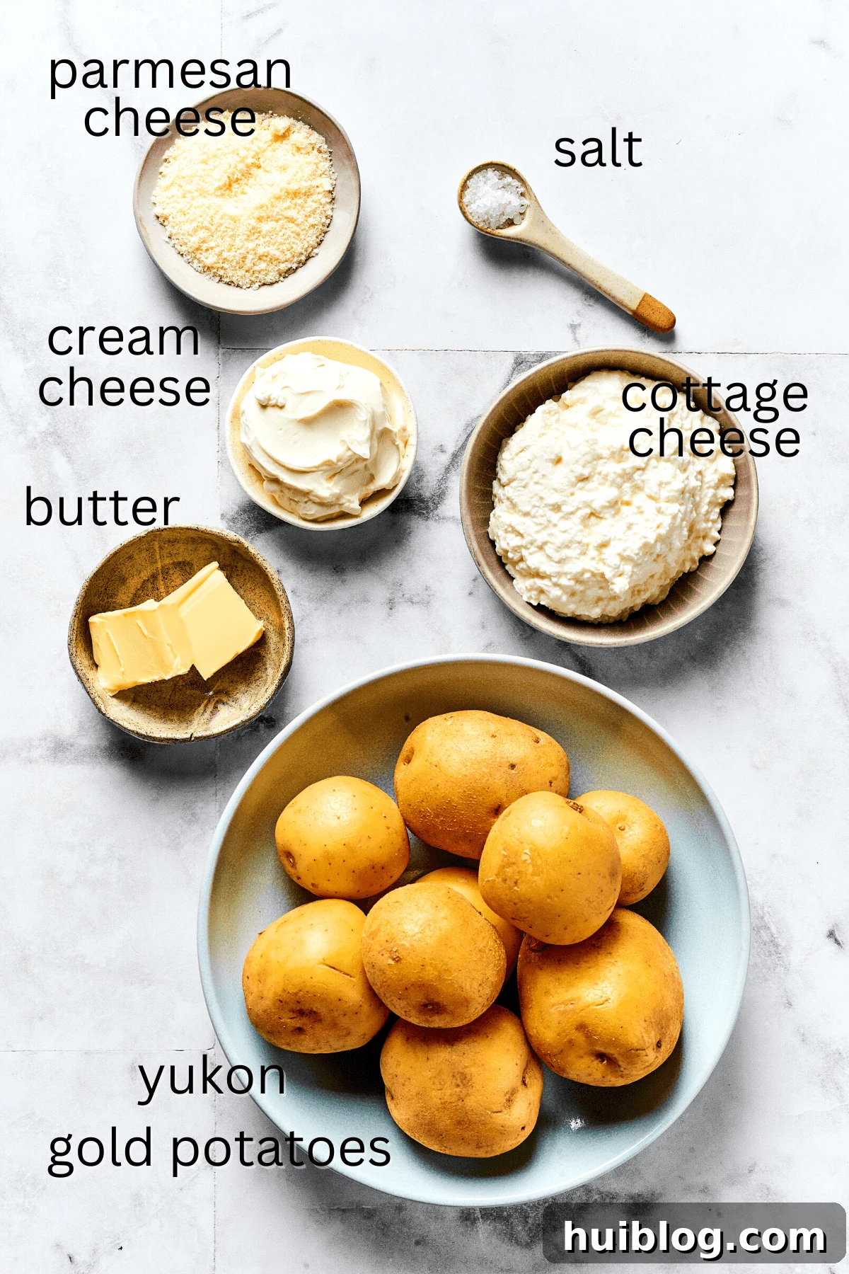 Topped with caramelized onion and crispy bacon, this easy Homemade Pierogi Recipe features a traditional cheese and potato filling. Yum! From top: Parmesan cheese, salt, sour cream, cottage cheese, butter, and Yukon Gold potatoes.