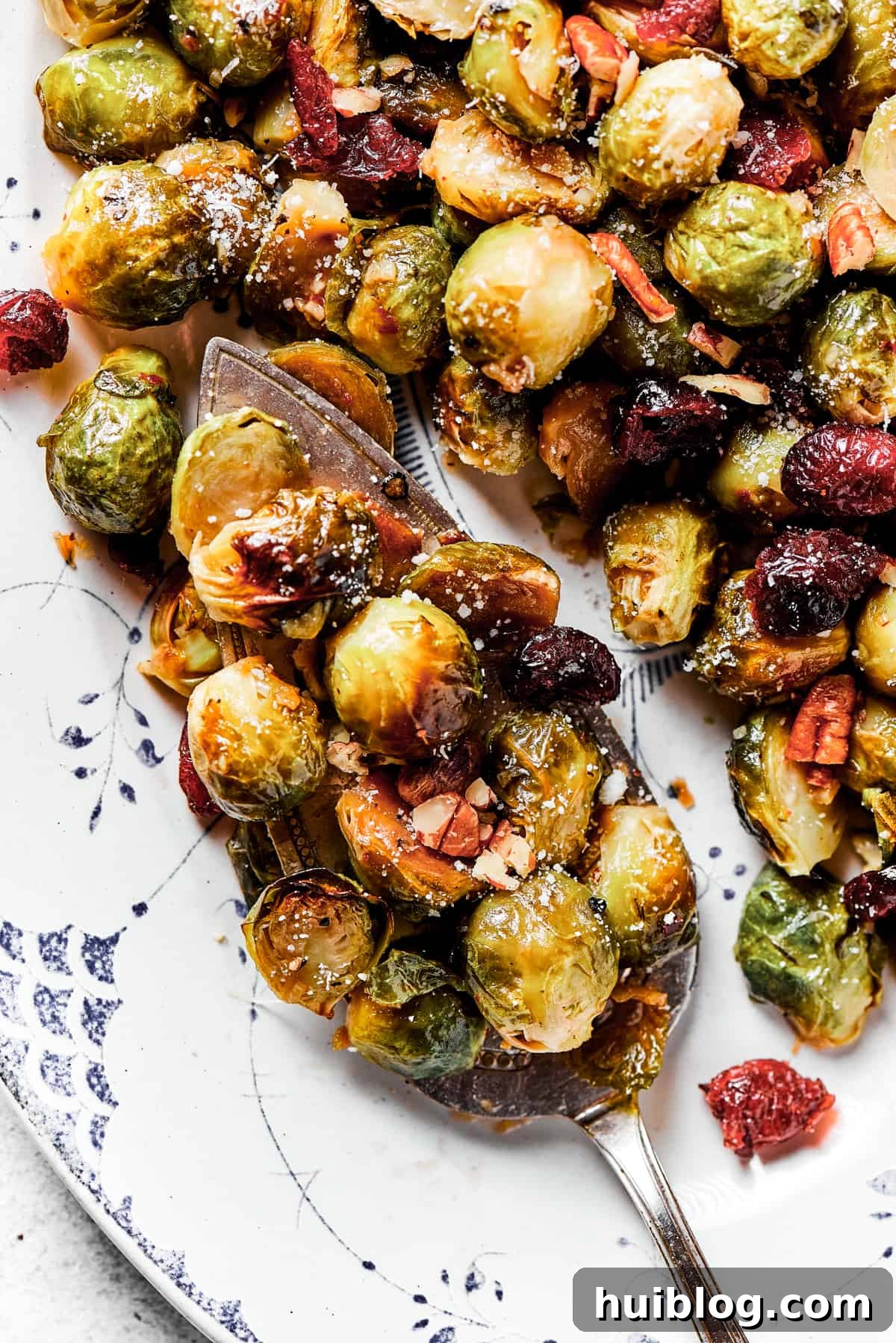 A generous serving platter piled high with golden roasted Brussels sprouts, ready to be enjoyed as a wholesome and delicious side dish.