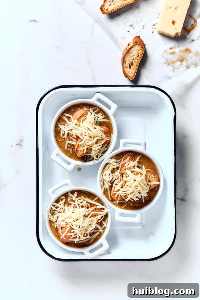 Caramelized Onion & Gruyère Soup 13 Individual bowls of French onion soup, beautifully topped with golden-brown melted Gruyère and Swiss cheese over toasted baguette.