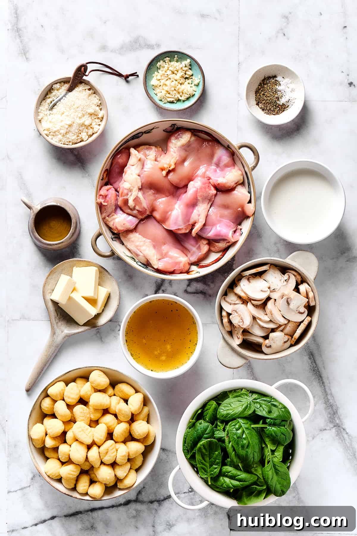 Chicken gnocchi ingredients measured and arranged on a table.