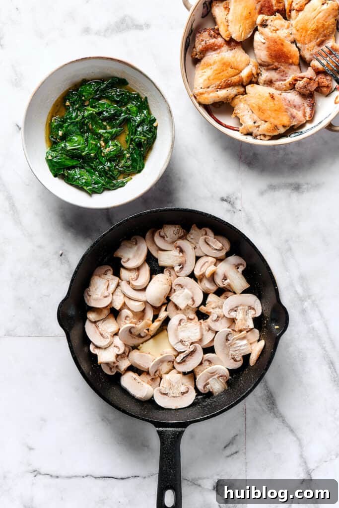 Sliced mushrooms cooking in a skillet.