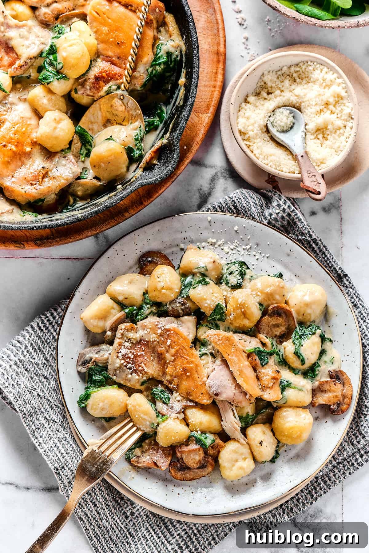 Creamy Chicken & Gnocchi - An Easy Restaurant-Worthy Recipe! An overhead shot of a dinner plate featuring a generous serving of creamy chicken gnocchi.