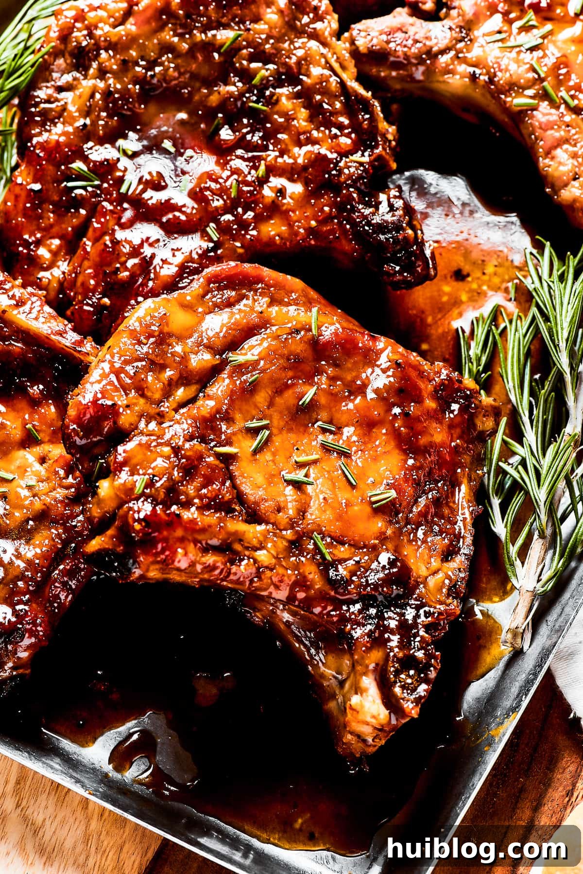 Gorgeous Brown Sugar Pork Chops may look fancy, but they are actually so simple to make! Savory, pan-fried chops with brown sugar glaze. Pork chops glazed in brown sugar sauce, garnished with fresh herbs, ready to serve.