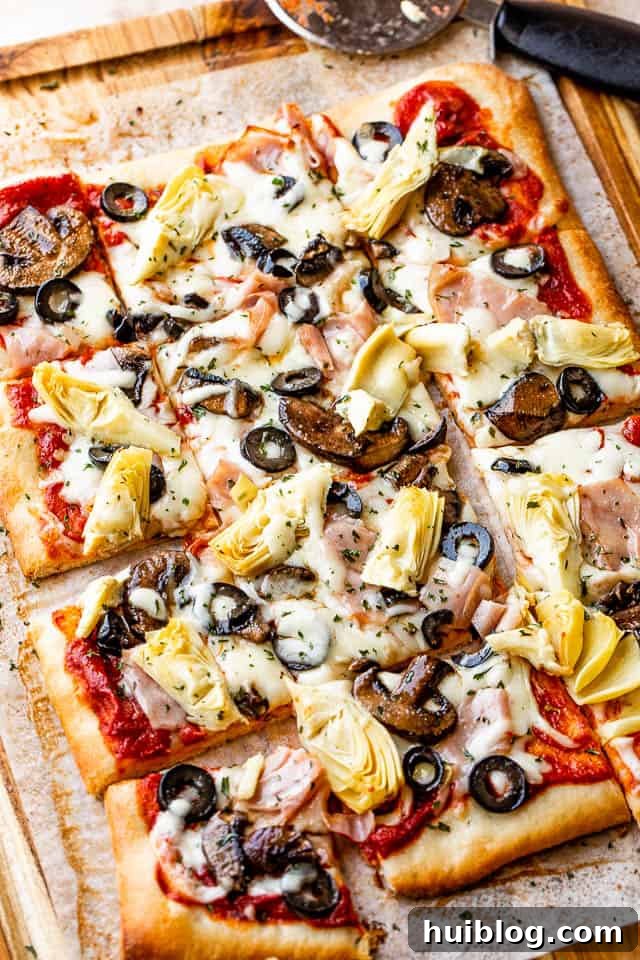 Smoky Capricciosa Pizza 2 rectangular capricciosa pizza cut into squares