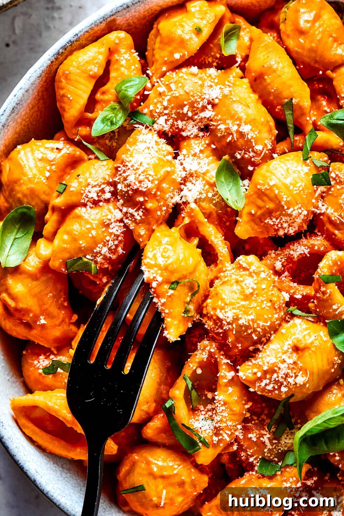 Gigi Hadid's Popular Pasta: Vodka Optional 2 A fork in a bowl of Gigi Hadid pasta, ready to be enjoyed.