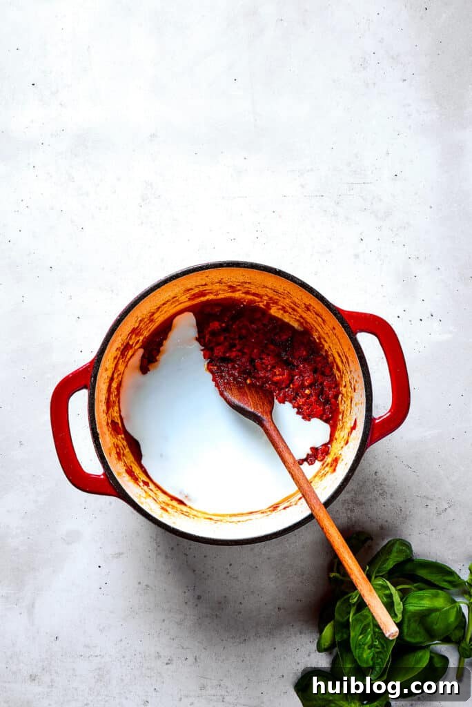 Gigi Hadid's Popular Pasta: Vodka Optional 8 Slowly stirring rich cream into the fragrant pot of tomato sauce for a velvety texture.
