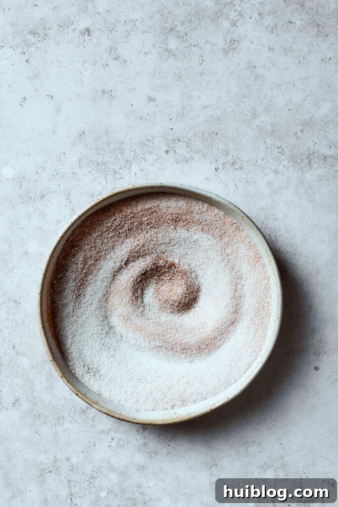 A bowl of cinnamon-sugar mixture.