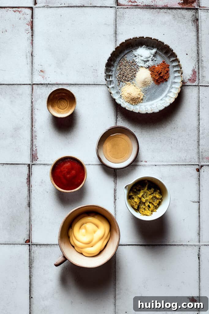 Dressing ingredients measured and arranged on a work surface.