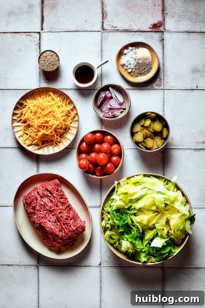 The ingredients for Big Mac salad, arranged on a work surface.