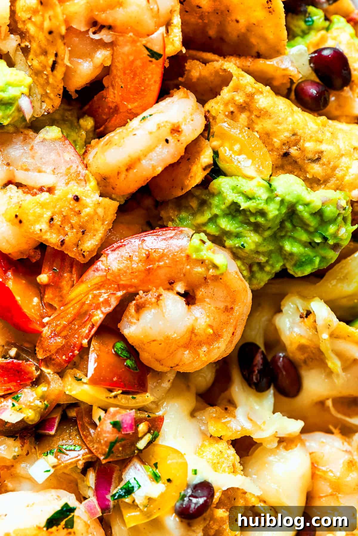 Coastal Crunch Shrimp Nachos 14 Closes-up of shrimp nachos.