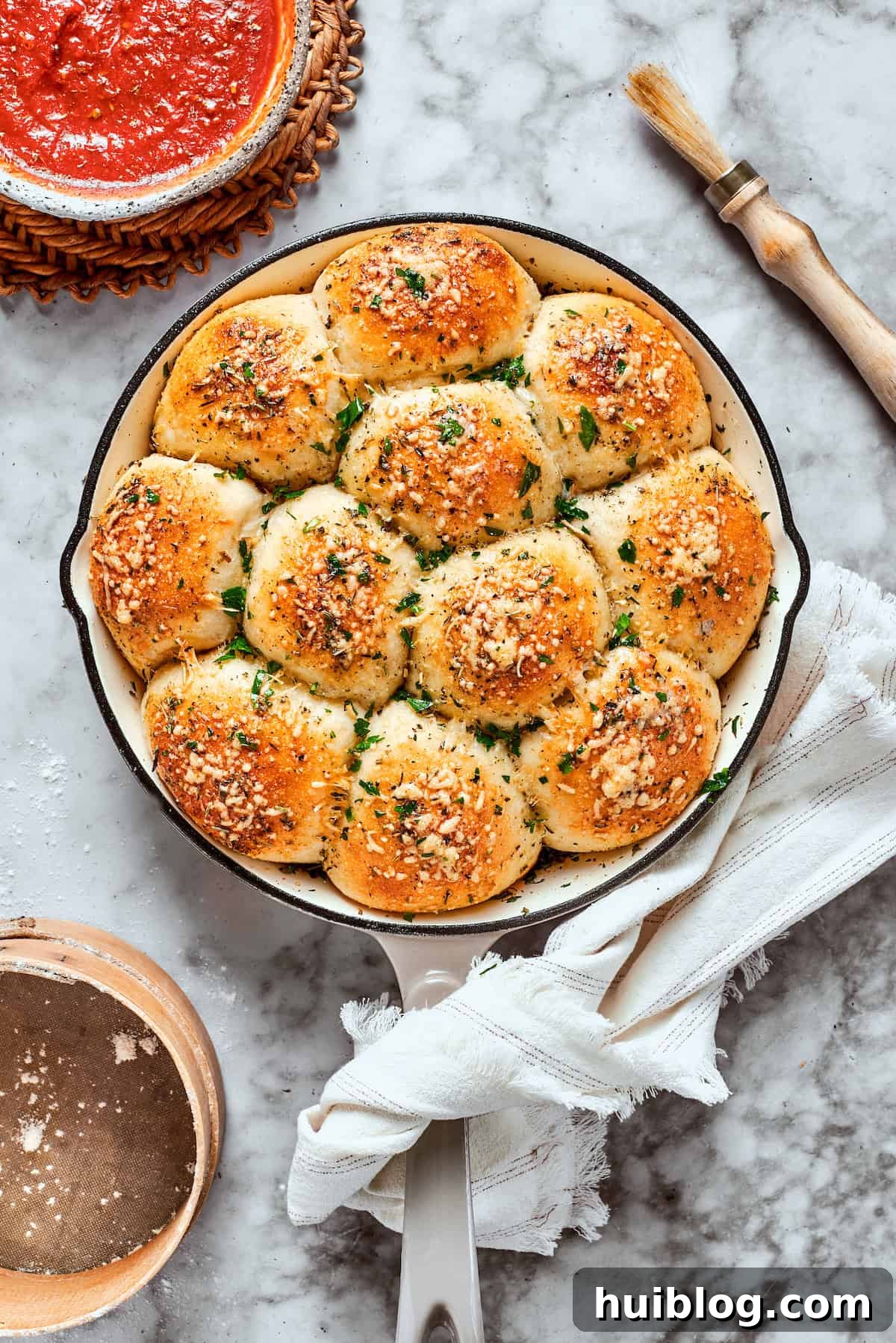 These easy homemade pizza bites are filled with pepperoni and mozzarella, brushed with herb butter. The pizza bites after being baked, golden brown and crispy.