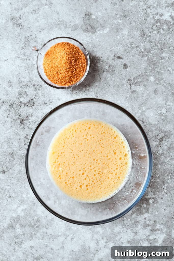 Melted butter and creamy sour cream are expertly combined in a mixing bowl, ready to be incorporated into the wet ingredients.