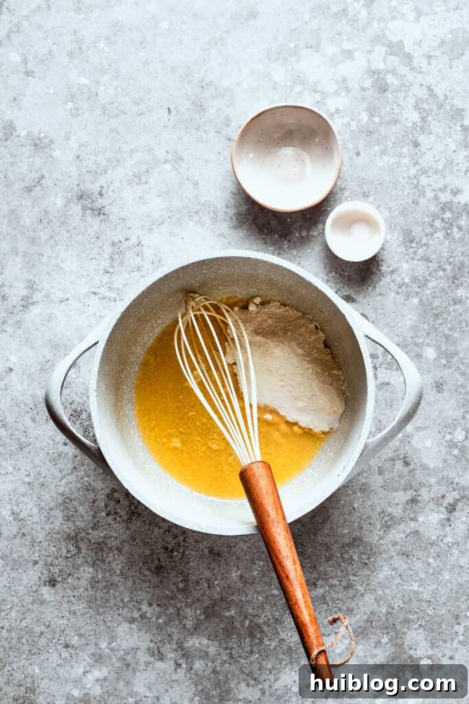 Flour is mixed into the roux.