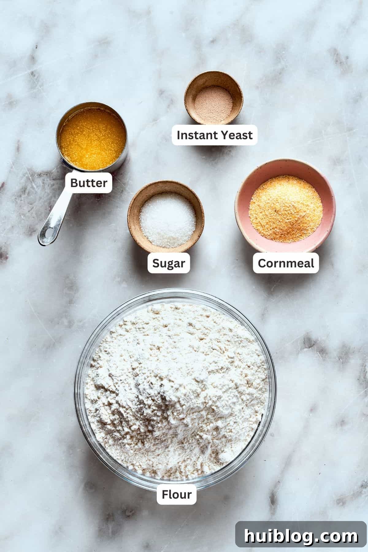 Deep dish pizza crust ingredients: flour, cornmeal, butter, sugar, instant yeast.