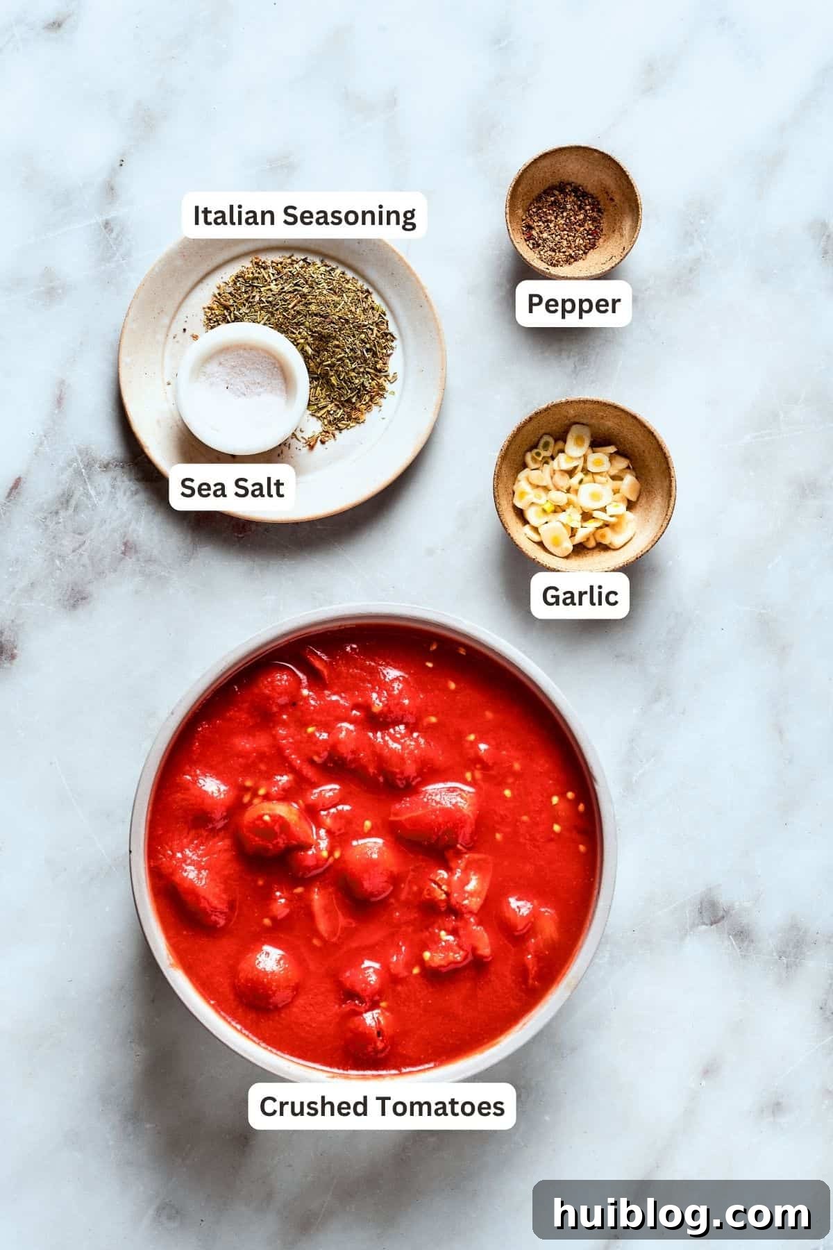 Deep dish pizza sauce ingredients: canned tomatoes, garlic, pepper, Italian seasoning, salt.