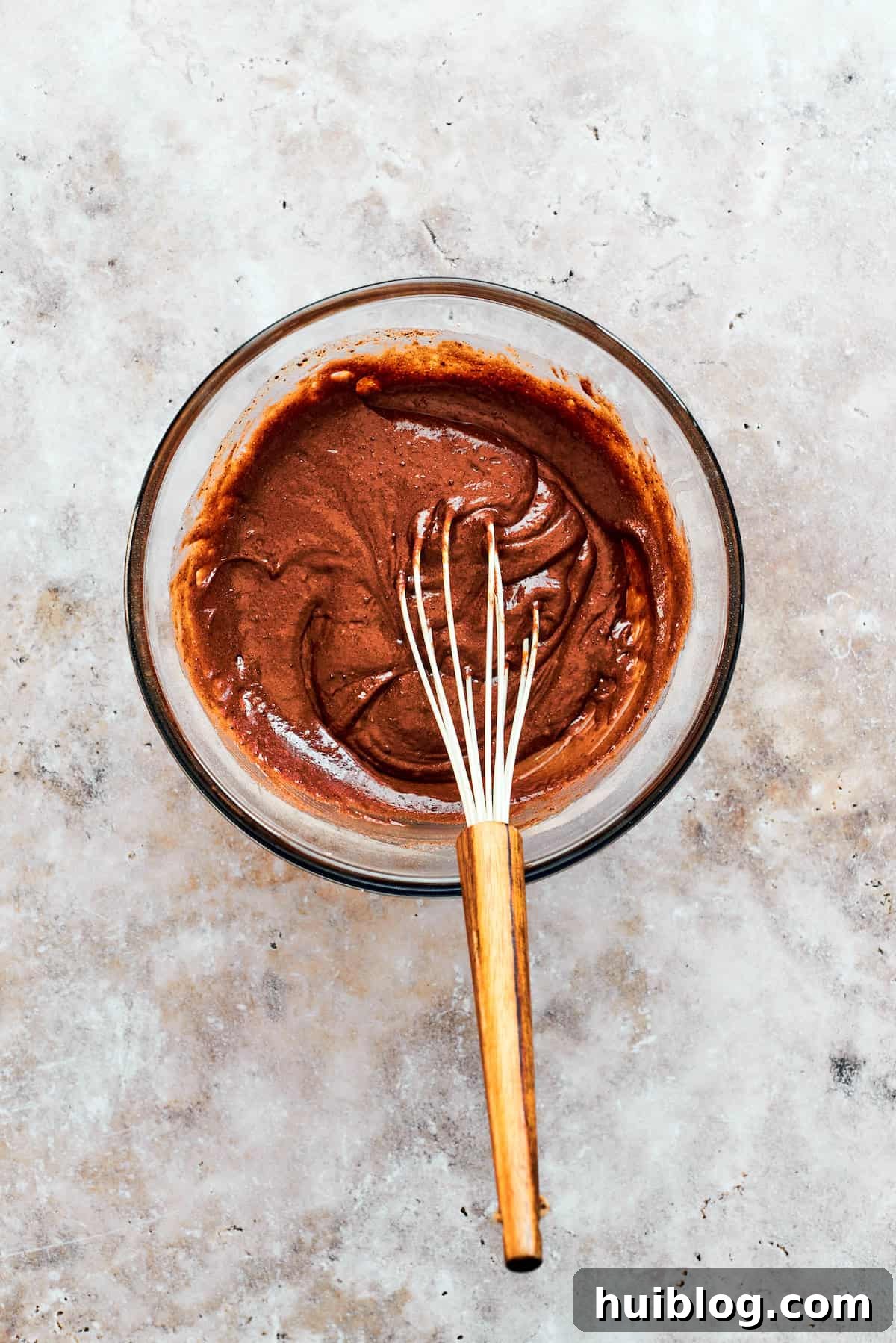 A whisk combines the cake batter.