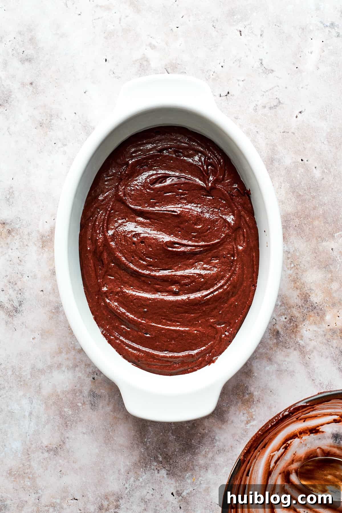 Chocolate pudding cake in an oval pan.