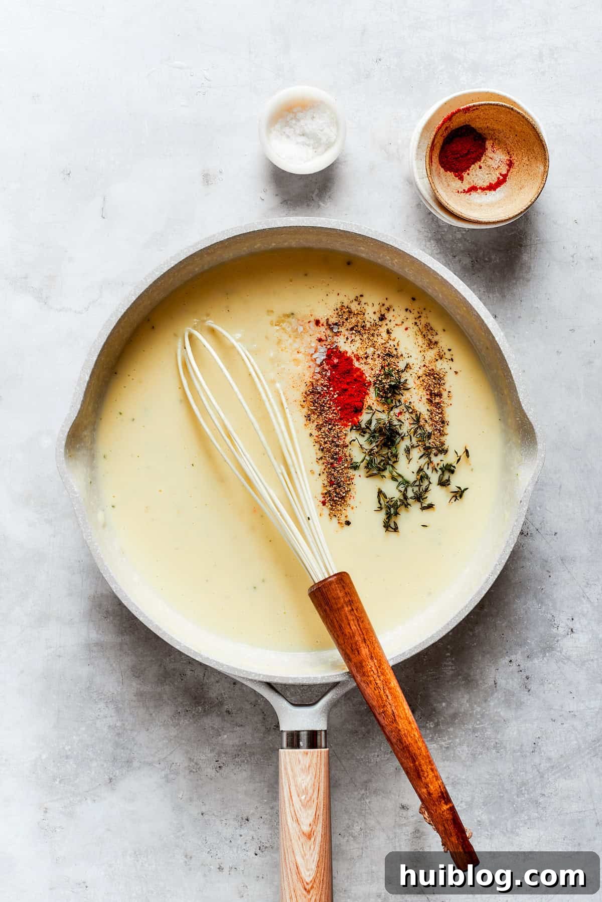 From-scratch Broccoli & Rice Casserole folds tender broccoli and fluffy white rice into a gorgeously creamy three-cheese sauce. Adding a blend of dried herbs and spices, including thyme and paprika, to the simmering roux to infuse the cheese sauce with rich flavor.