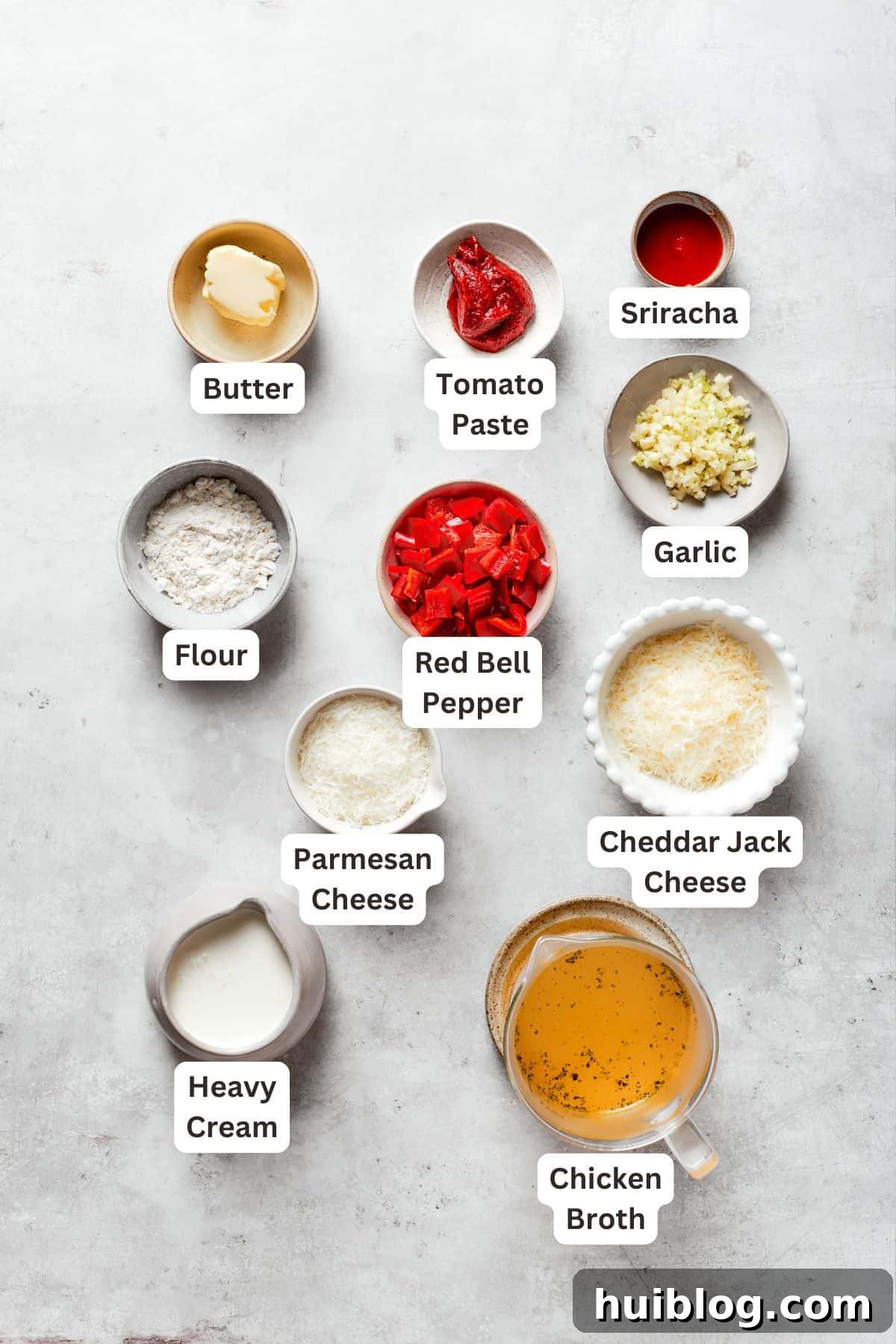Labeled ingredients for cajun shrimp sauce include butter, tomato pasta, garlic, sriracha, cheddar jack cheese, parmesan cheese, heavy cream, chicken broth.