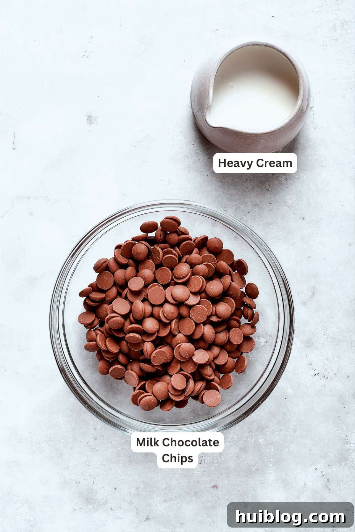 Labeled ingredients for the rich chocolate ganache layer, consisting of heavy cream and chocolate chips, ready to be transformed.