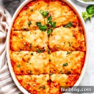 Overhead image of baked million dollar spaghetti in a casserole dish.