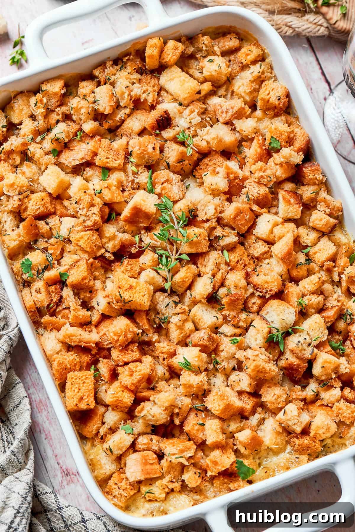 This chicken stuffing casserole features tender chicken filling with veggies topped with classic stuffing. An easy recipe baked until golden! Freshly baked chicken stuffing casserole with a golden, crispy topping in a 9x13 inch dish.