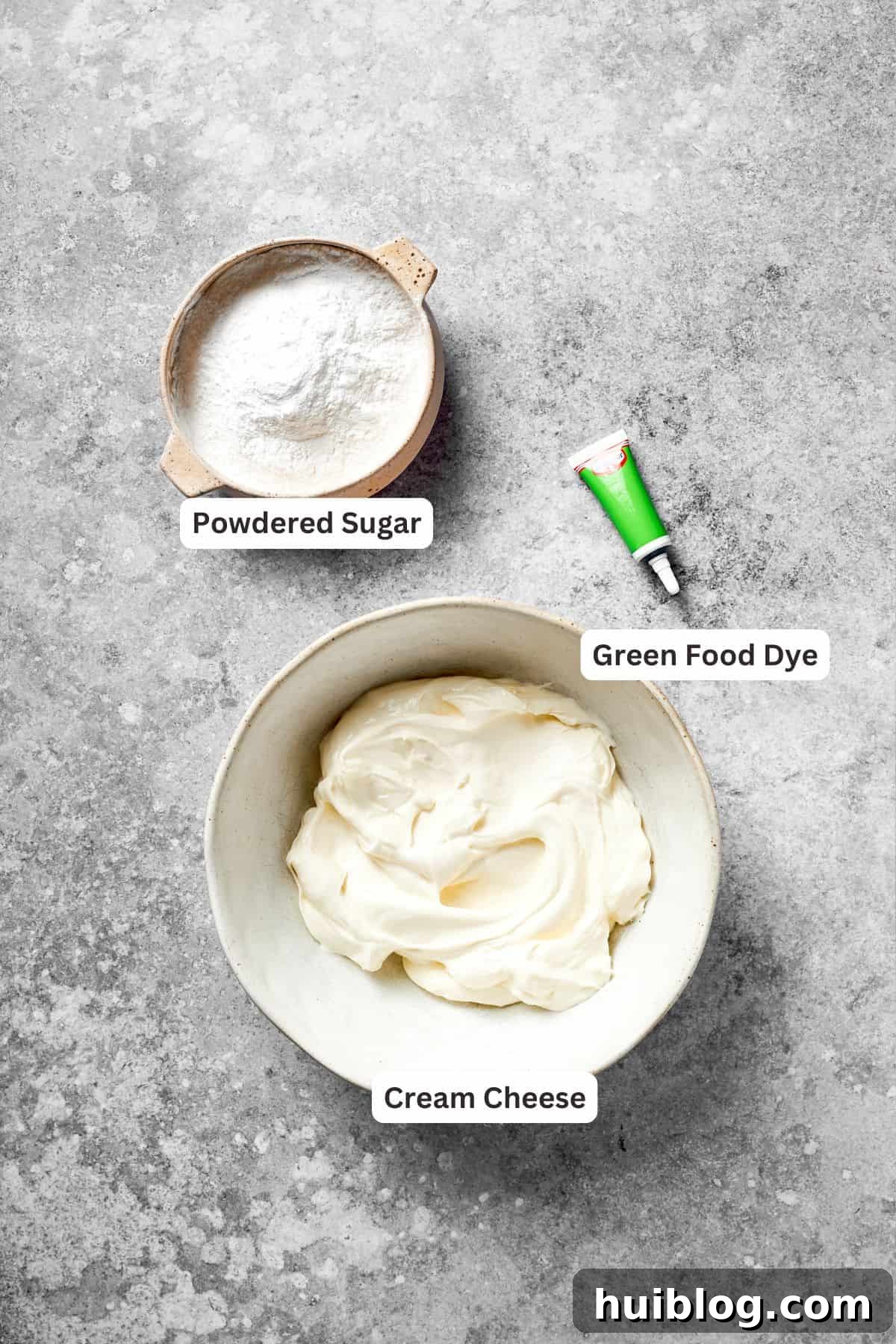 The frosting ingredients for grinch cake are labeled, including cream cheese, powdered sugar, and green food dye.