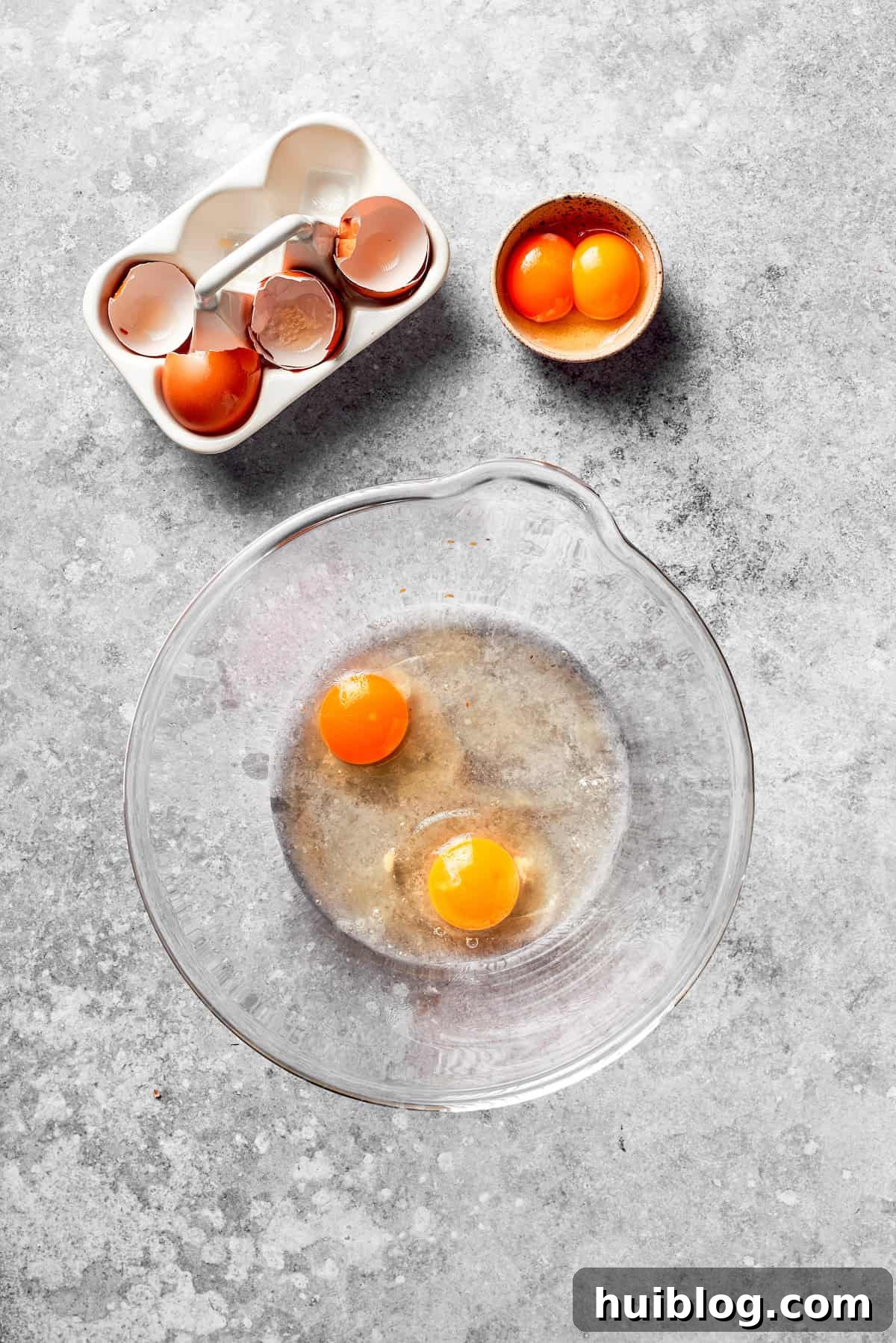 Eggs cracked in a bowl, ready to be whisked.