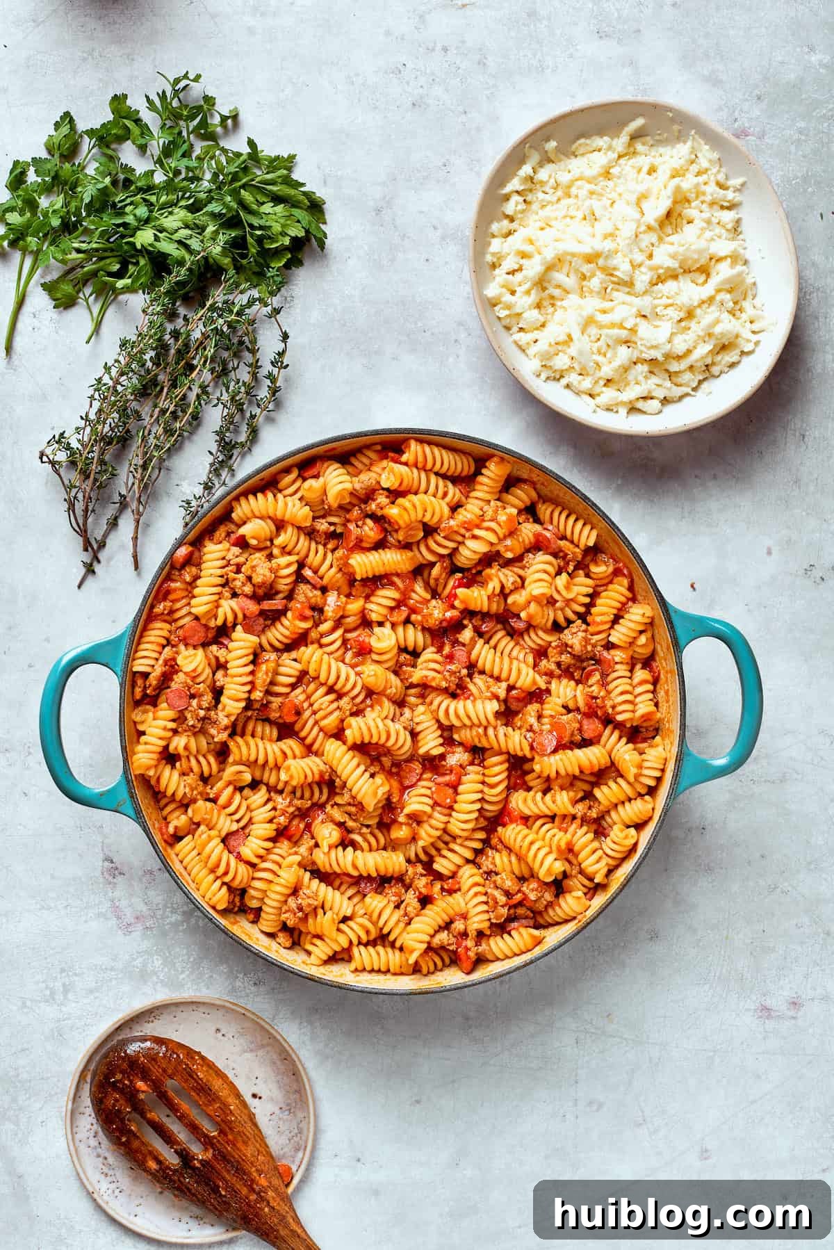 The pasta simmers gently in the rich sauce, absorbing the flavors and softening to a tender perfection.