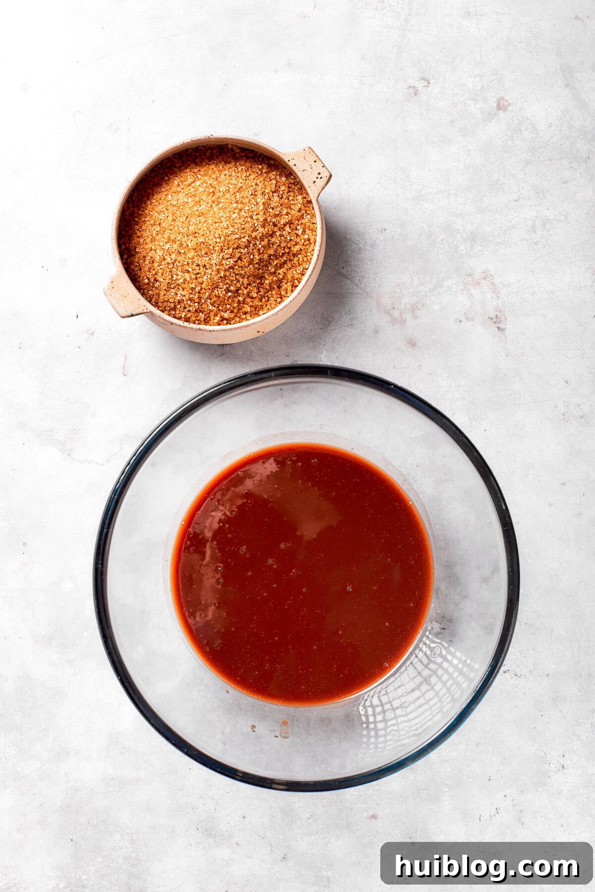 Oil and sugar mixed in a bowl.