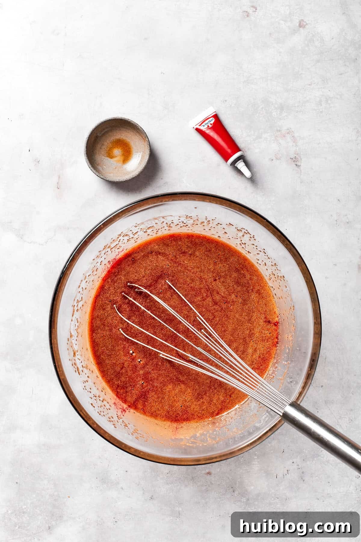 Vanilla is whisked into red velvet brownie batter,