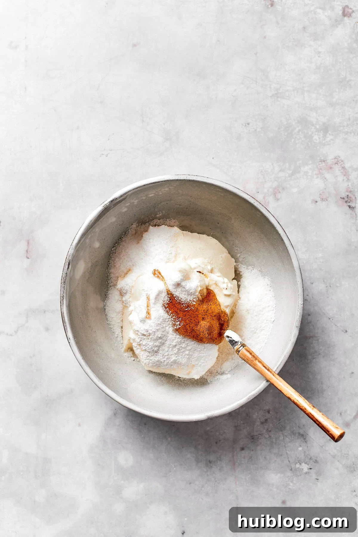 Cream cheese and butter creamed in a bowl.