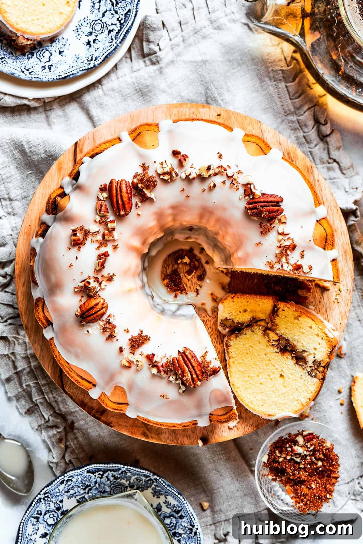 Overhead shot of a glazed sock it to me cake topped with pecans.