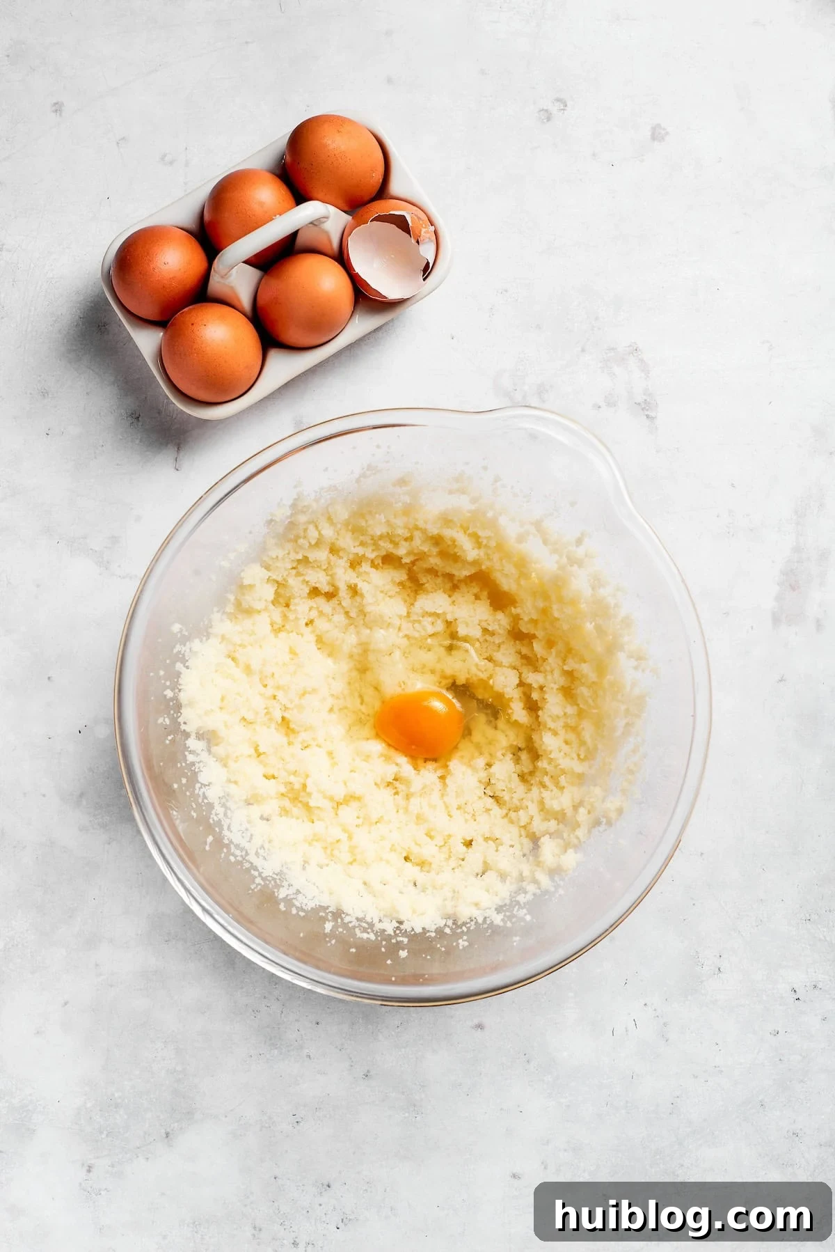 Eggs are added to creamed butter and sugar.