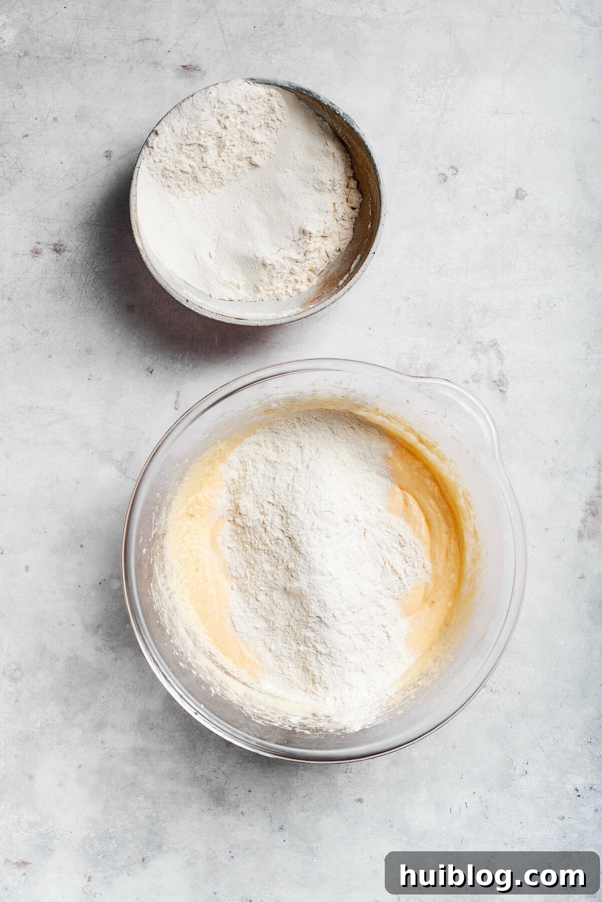 Flour mix is added to sock it to me cake batter.