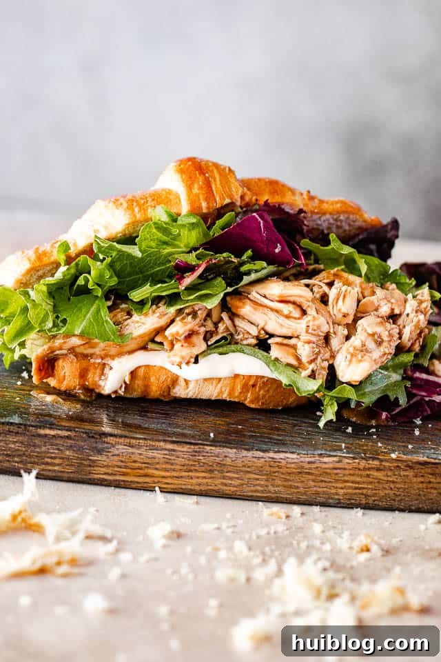 side view of shredded bbq chicken croissant sandwich